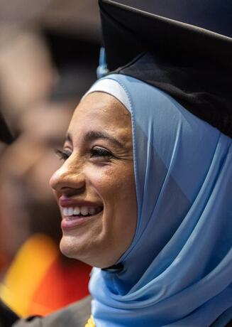 Woman smiling at commencement