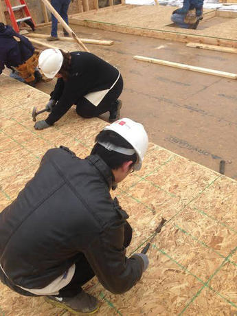 Students working on a construction site