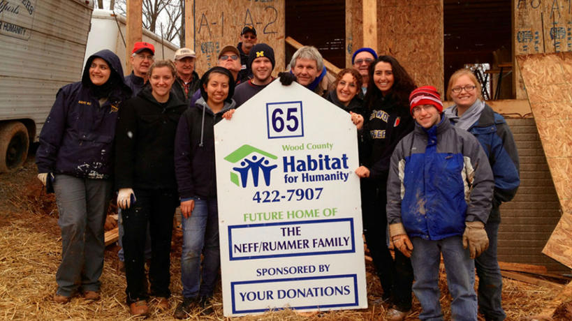 A group of UM-Dearborn volunteers participating in a Habitat for Humanity project