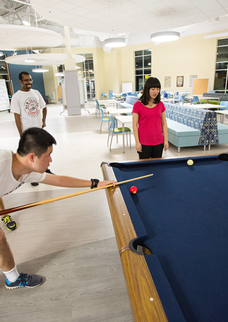 Students playing pool at the Union at Dearborn