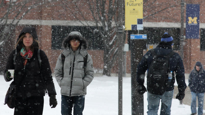 Students walking on snowy campus