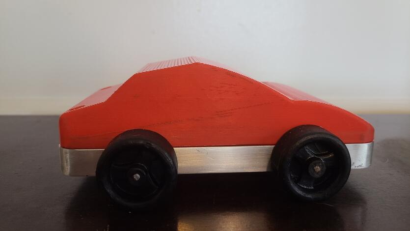 Toy car. The toy demonstrates the STEM concept of the conservation of energy by transforming stored elastic energy (of a rubber band) into kinetic energy that moves that car.