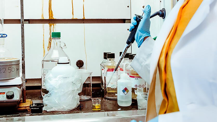 In Professor Krisanu Bandyopadhyay’s nanotechnology lab, student Arwa Saleem manipulates chemicals beneath a protective hood.